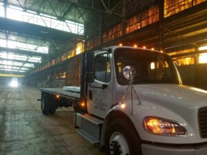 The picture depicts an O’Donnell semi-trailer truck in a large warehouse with high ceilings.